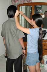 Ami combing Alan's hair